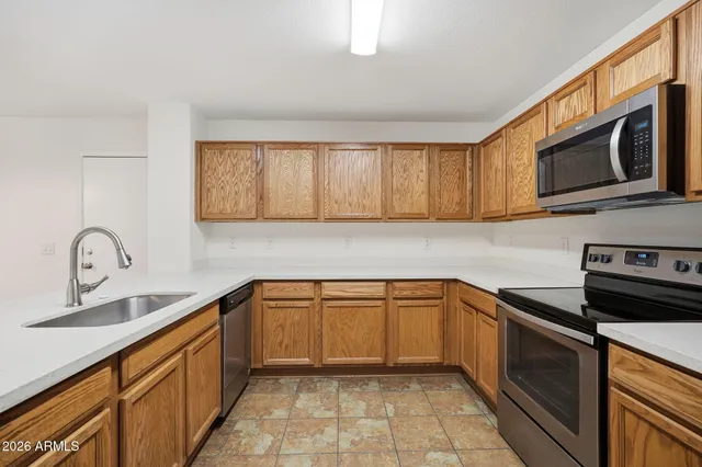 a view of a kitchen with microwave and cabinets