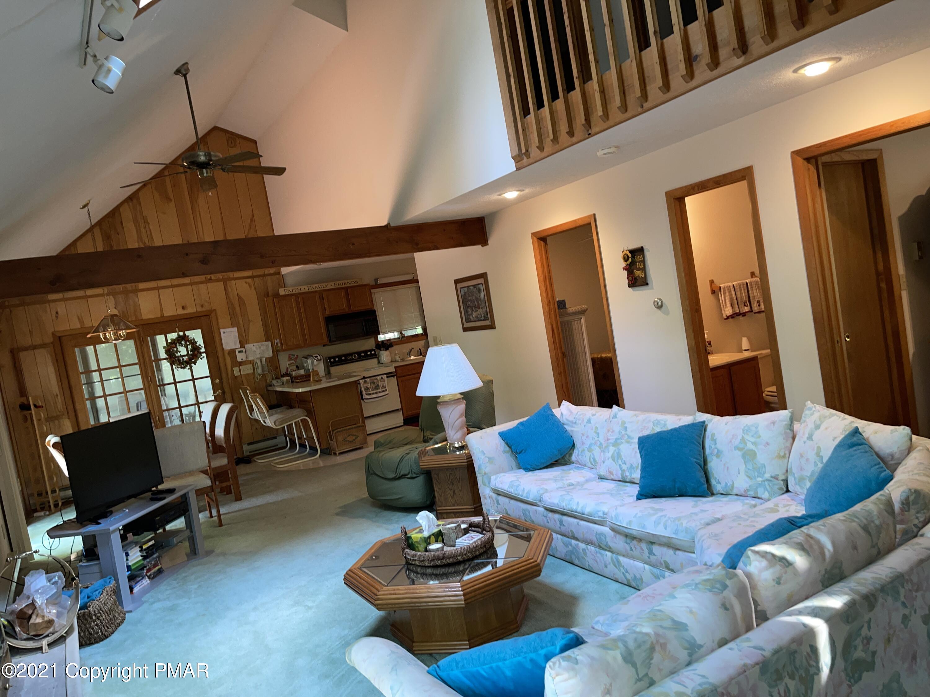 139 Dunchurch Drive Bushkill, PA 18324 - Photo 11 of 37 a living room with furniture and a flat screen tv