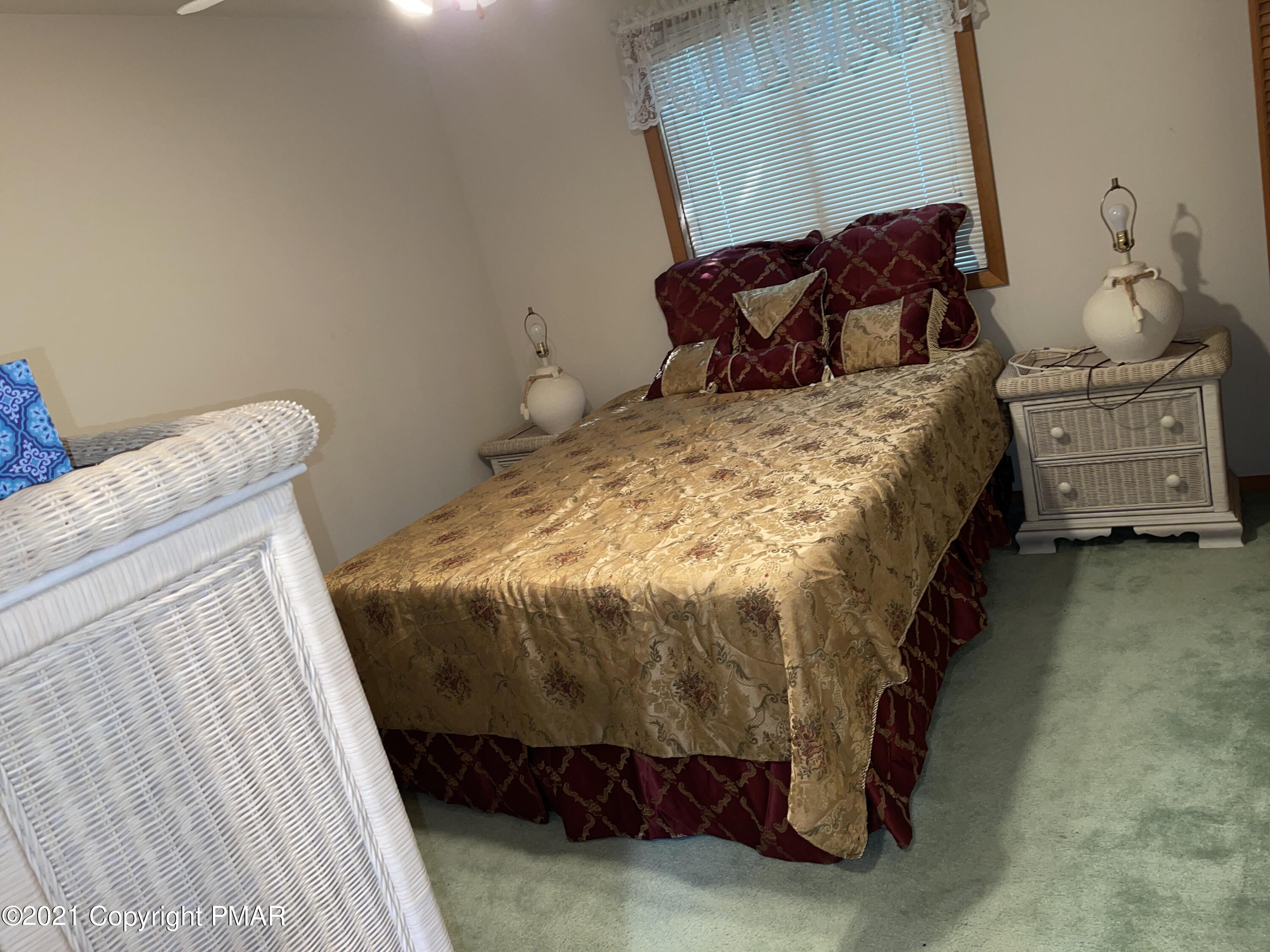 139 Dunchurch Drive Bushkill, PA 18324 - Photo 12 of 37 a bedroom with a bed and a window