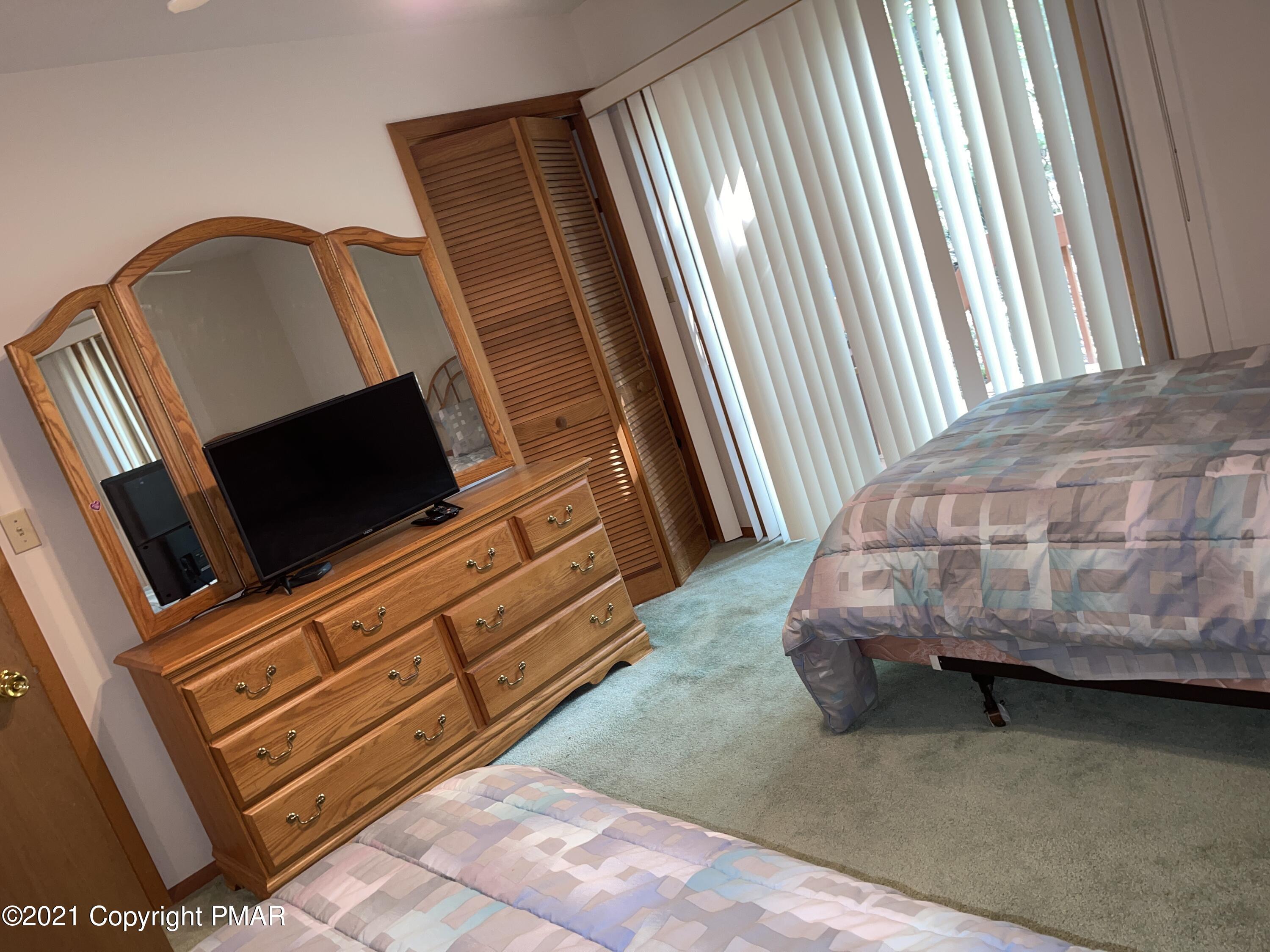 139 Dunchurch Drive Bushkill, PA 18324 - Photo 15 of 37 a living room with furniture and a fireplace