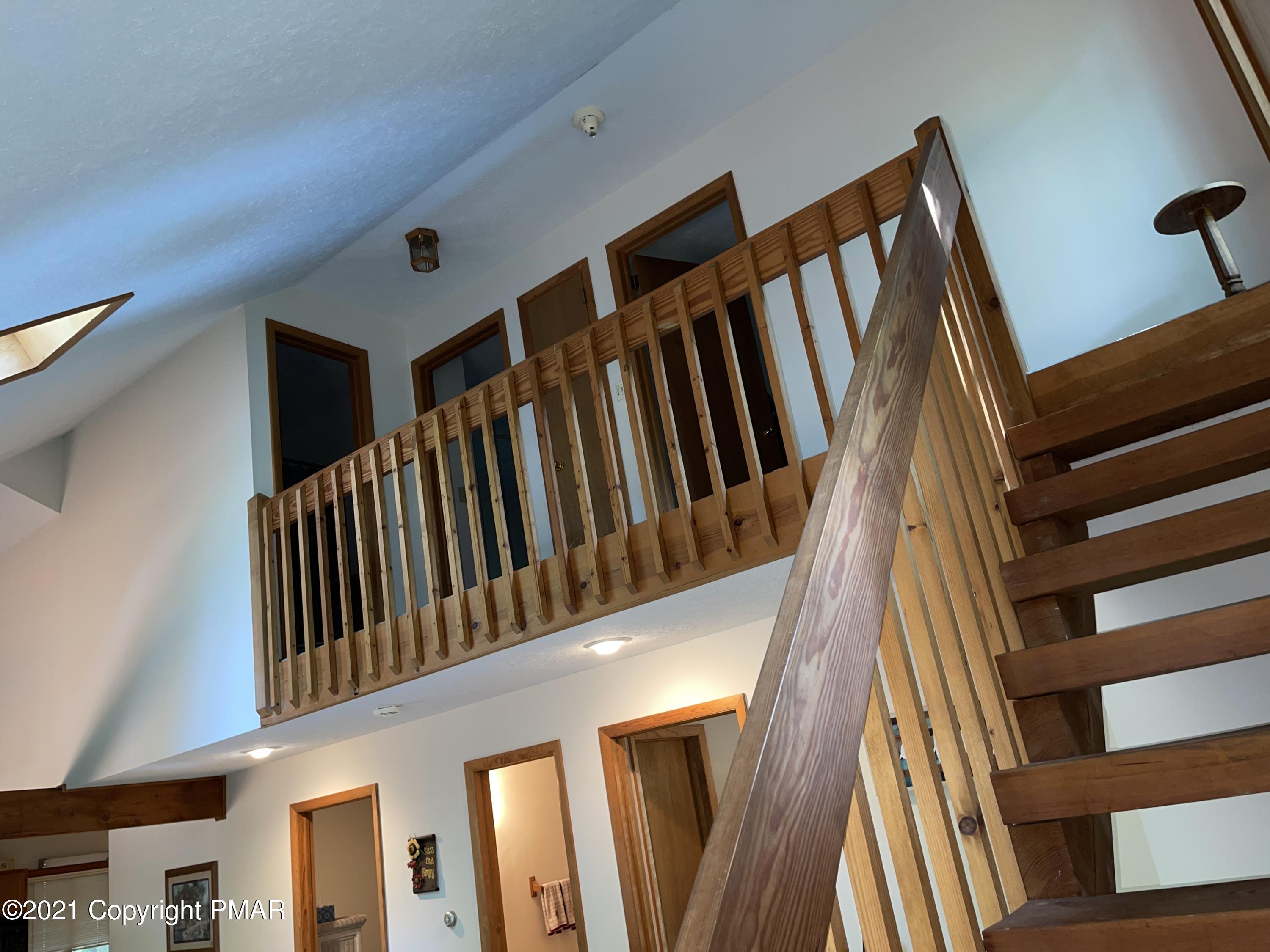 139 Dunchurch Drive Bushkill, PA 18324 - Photo 18 of 37 a view of wooden staircase