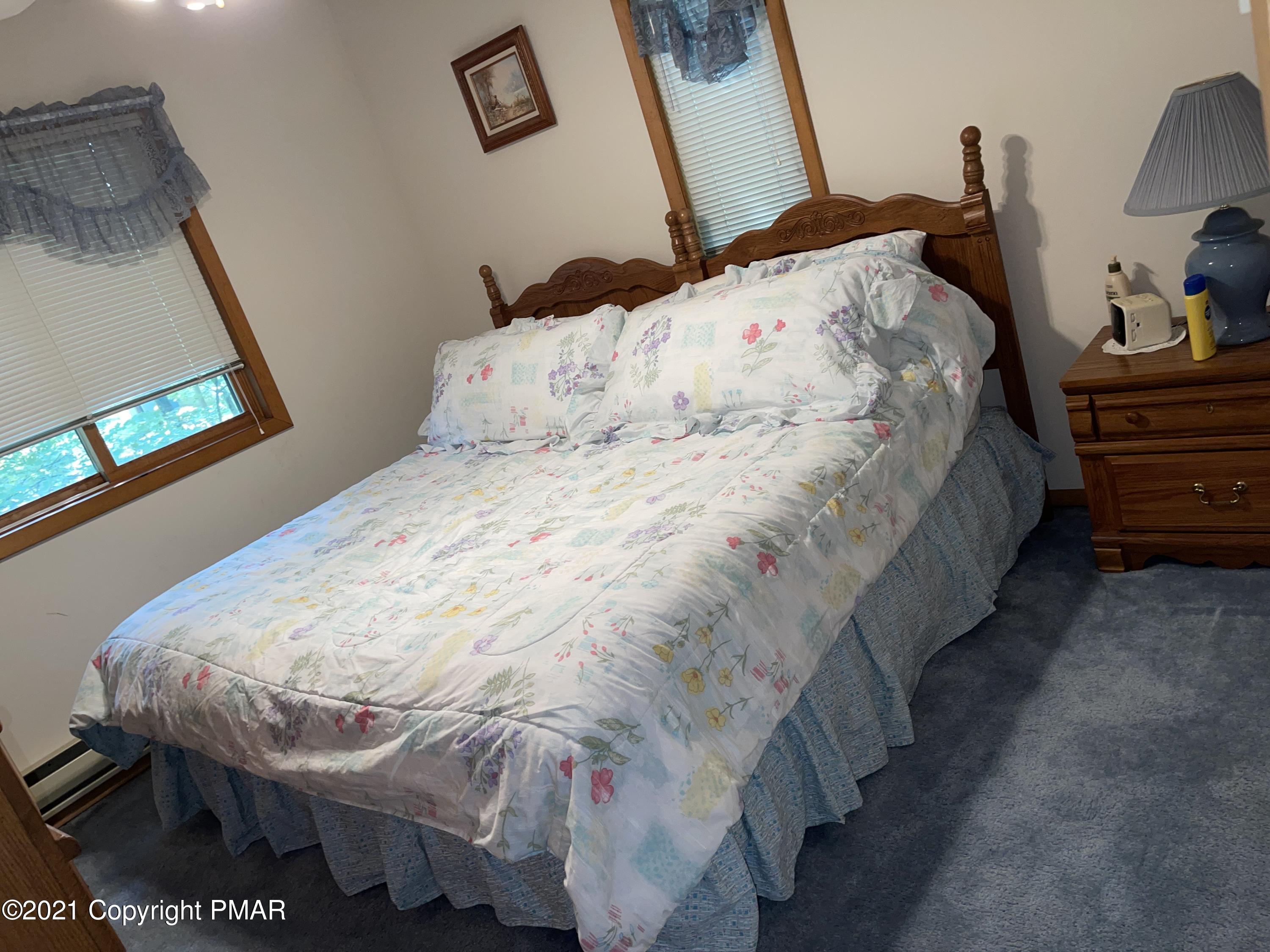 139 Dunchurch Drive Bushkill, PA 18324 - Photo 22 of 37 a bed sitting in a bedroom next to a window
