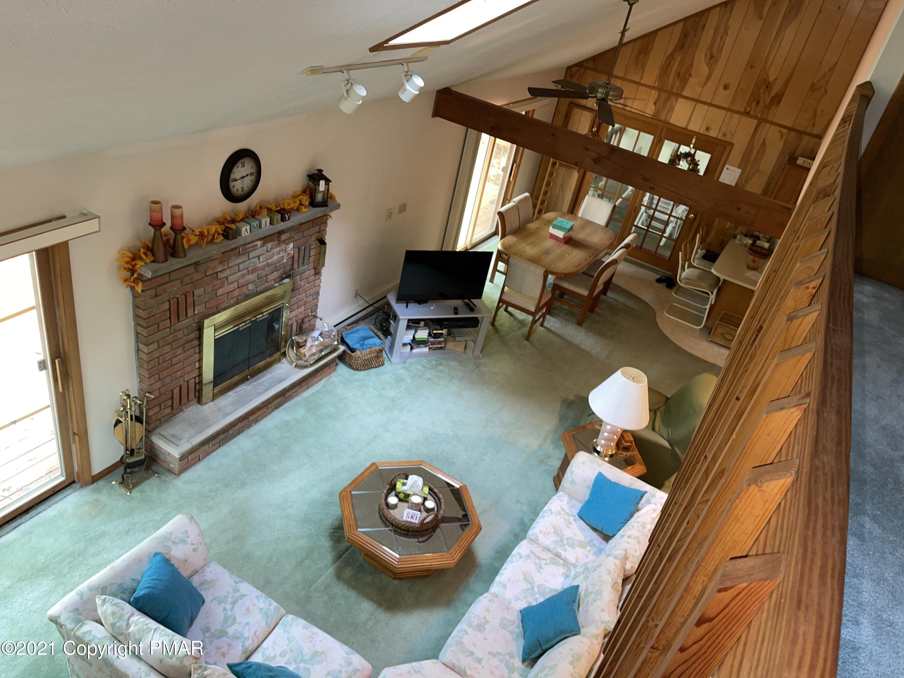 139 Dunchurch Drive Bushkill, PA 18324 - Photo 25 of 37 a living room with furniture and a fireplace