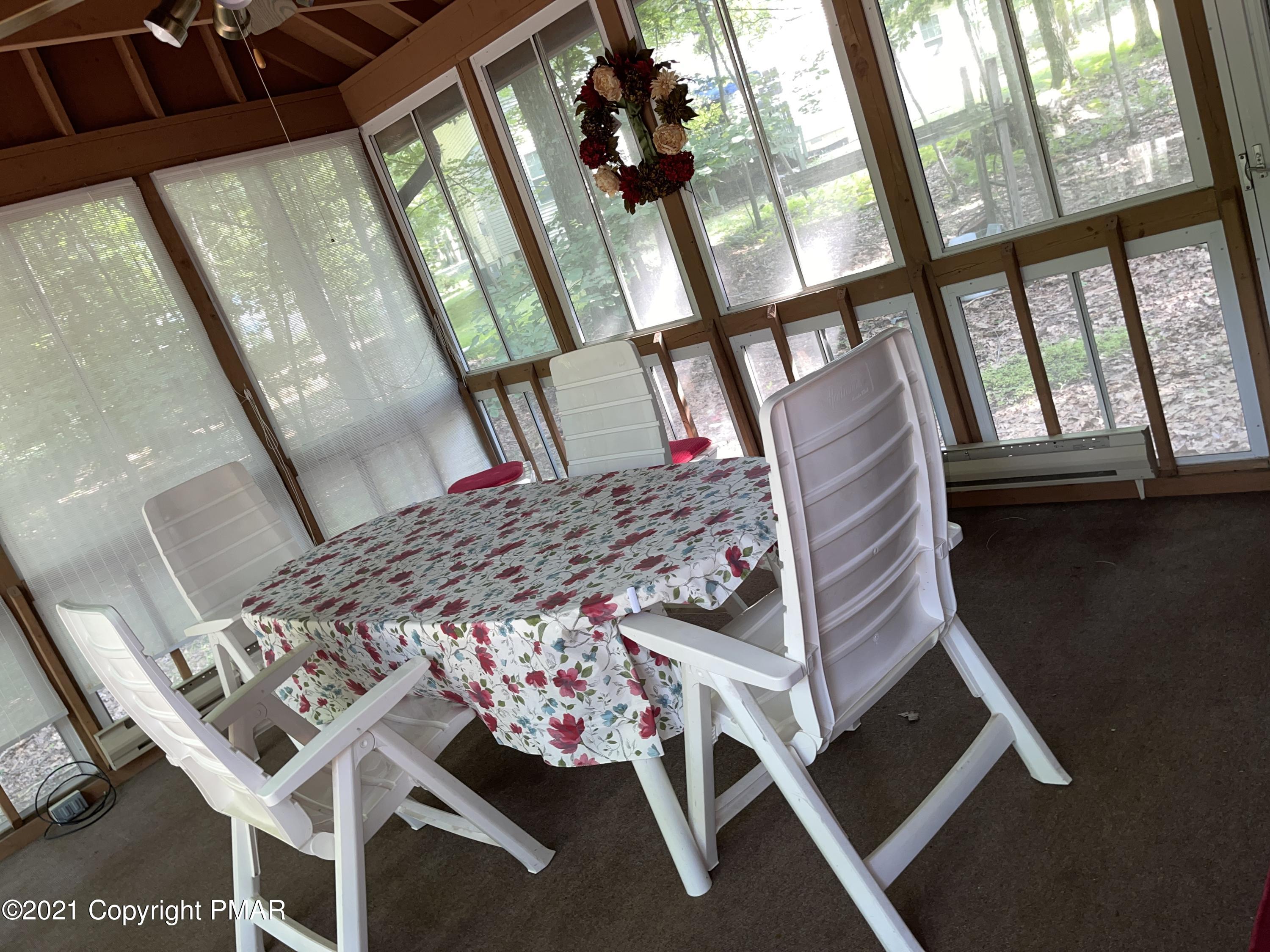 139 Dunchurch Drive Bushkill, PA 18324 - Photo 26 of 37 a living room with a bed furniture and a large window