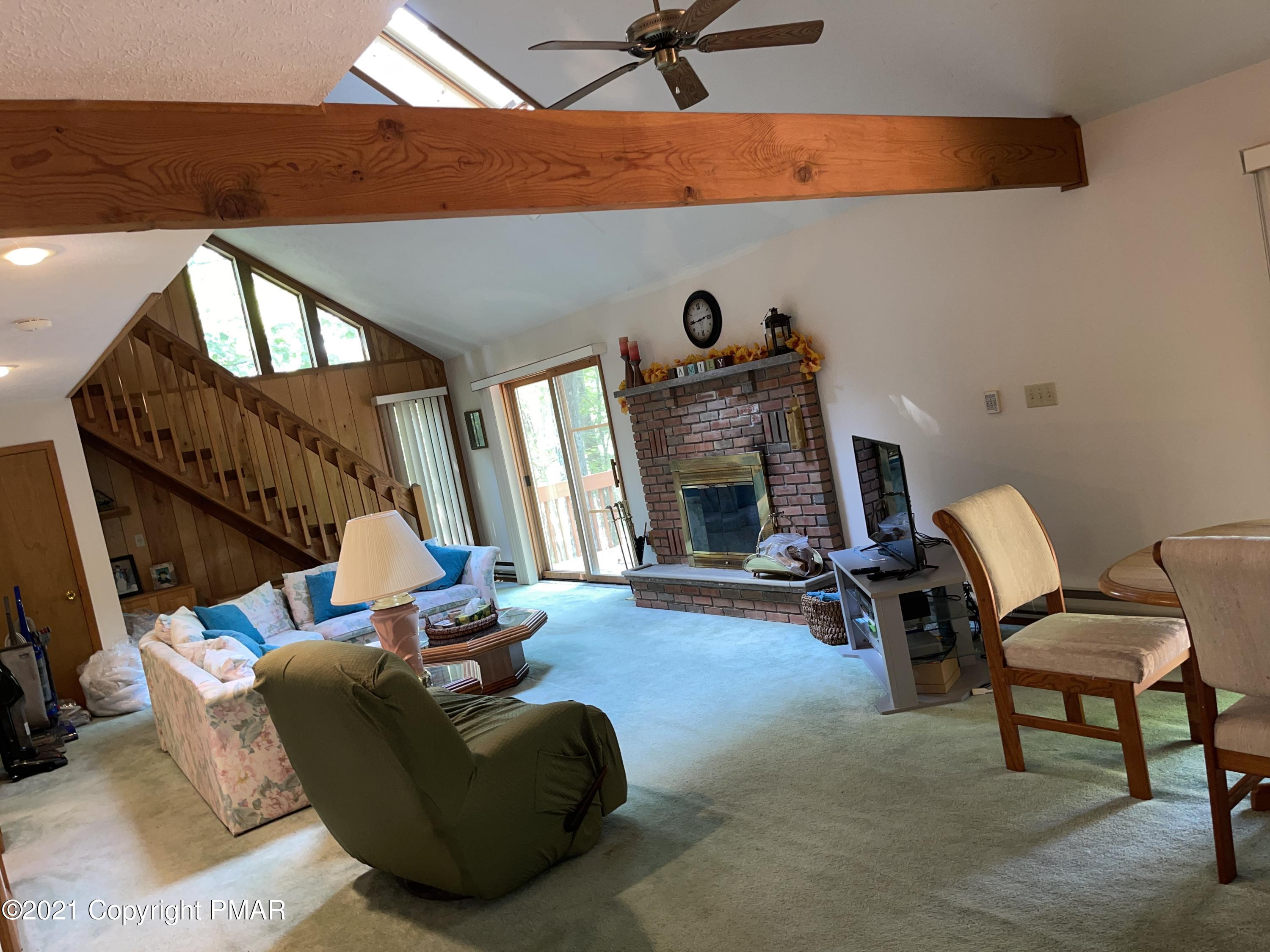 139 Dunchurch Drive Bushkill, PA 18324 - Photo 8 of 37 a living room with furniture and a fireplace