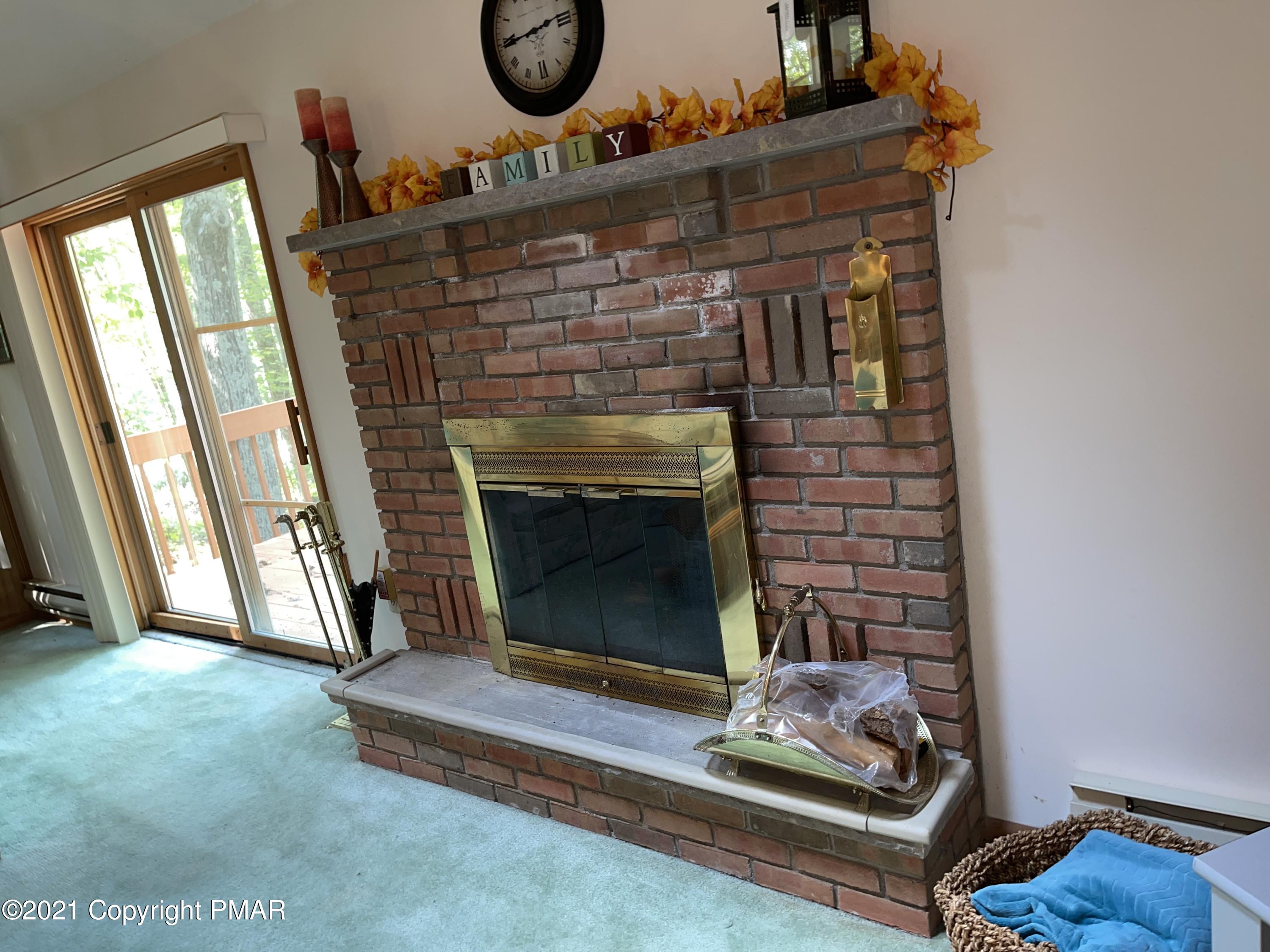 139 Dunchurch Drive Bushkill, PA 18324 - Photo 10 of 37 a living room with furniture and a fireplace
