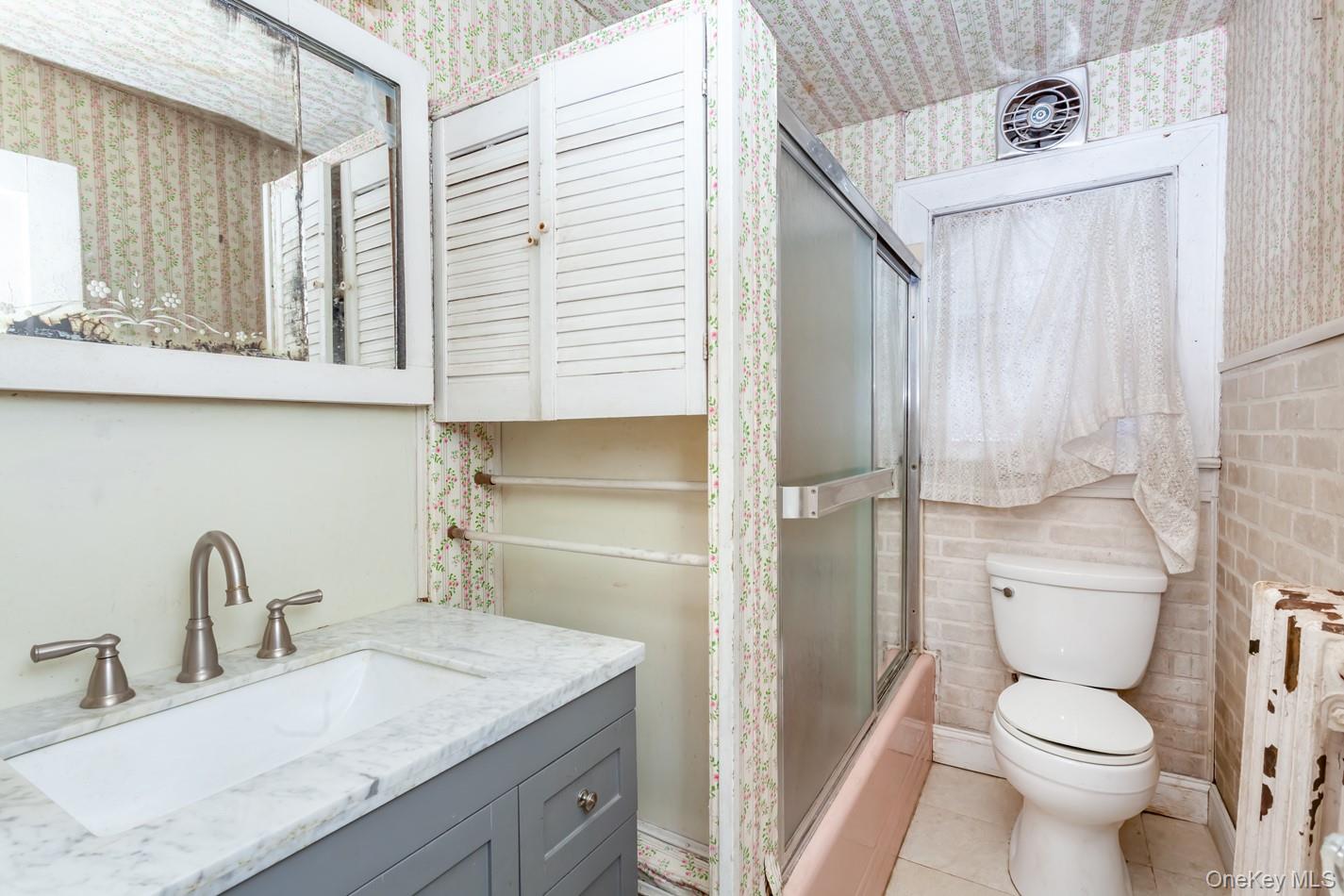 616 Union Avenue Peekskill, NY 10566 - Photo 15 of 39 a bathroom with a granite countertop sink toilet and shower