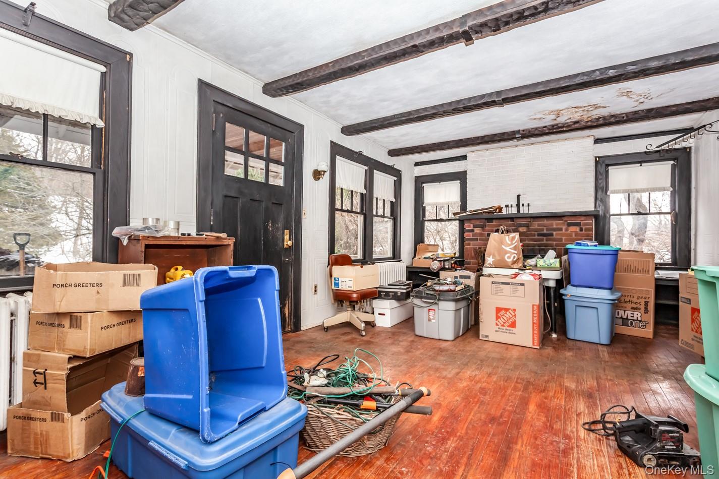 616 Union Avenue Peekskill, NY 10566 - Photo 27 of 39 a living room with furniture windows and wooden floor