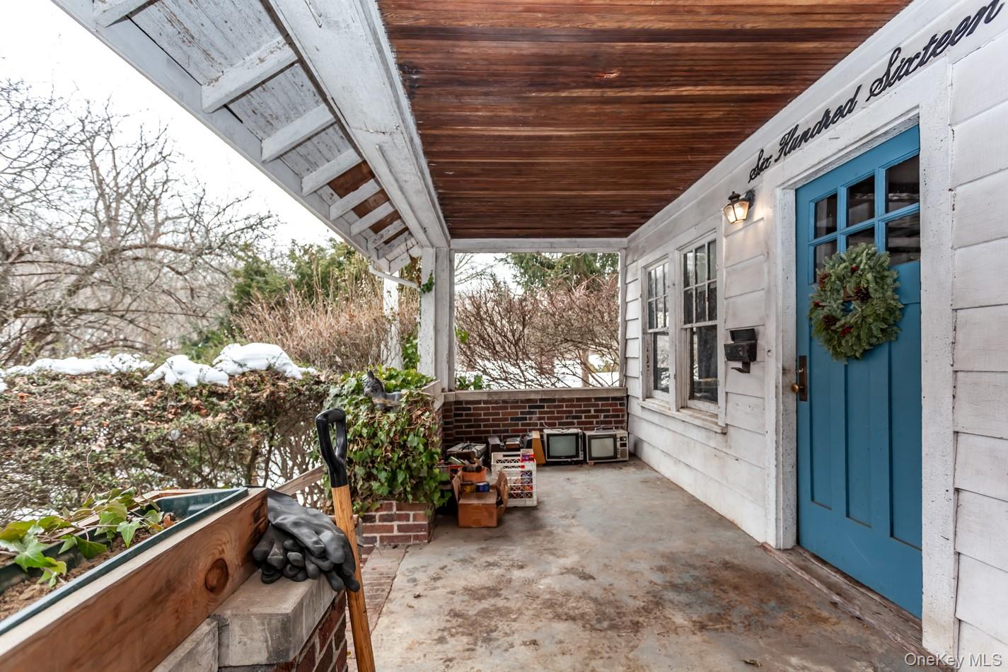 616 Union Avenue Peekskill, NY 10566 - Photo 3 of 39 a view of a porch with furniture and next to a yard