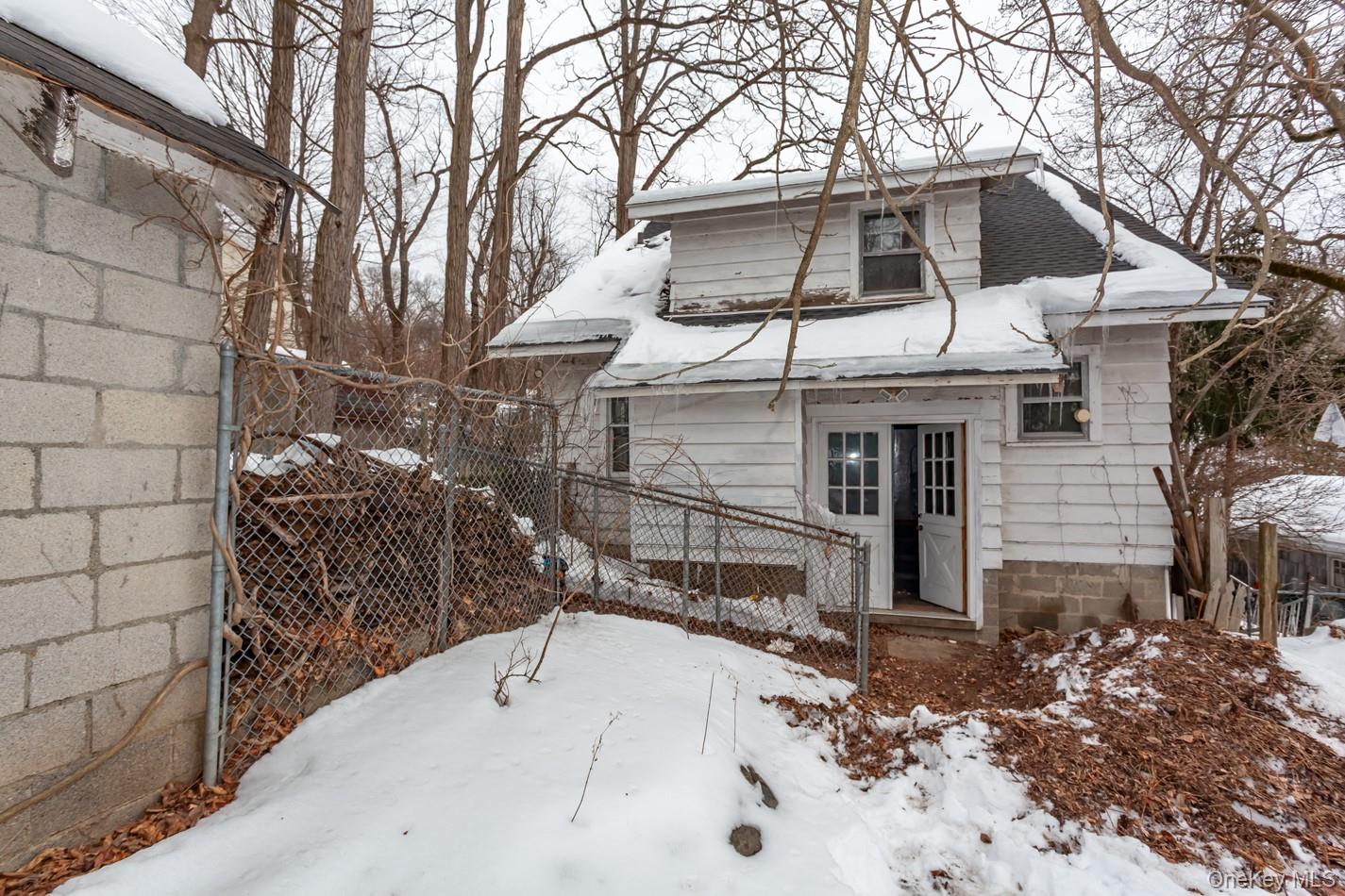616 Union Avenue Peekskill, NY 10566 - Photo 39 of 39 a white building with a tree in front of it