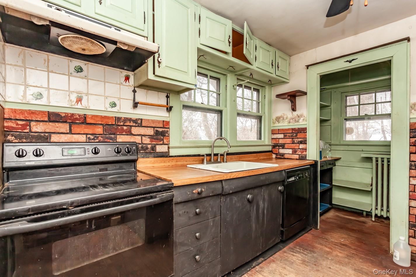 616 Union Avenue Peekskill, NY 10566 - Photo 4 of 39 a kitchen with stainless steel appliances granite countertop a stove and a sink