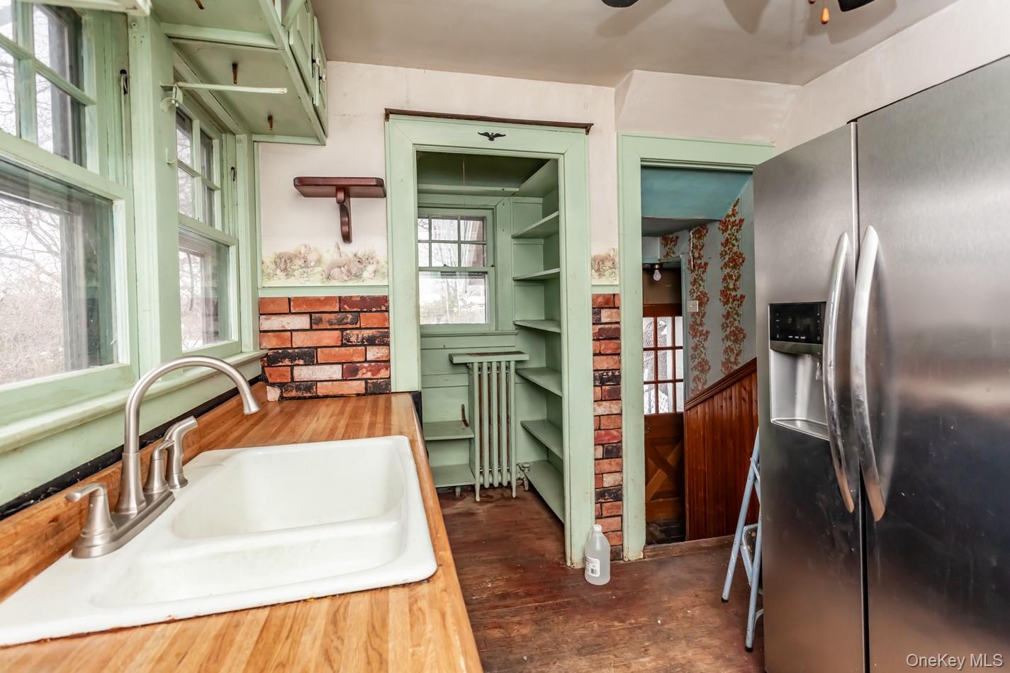 616 Union Avenue Peekskill, NY 10566 - Photo 5 of 39 a kitchen with refrigerator and window
