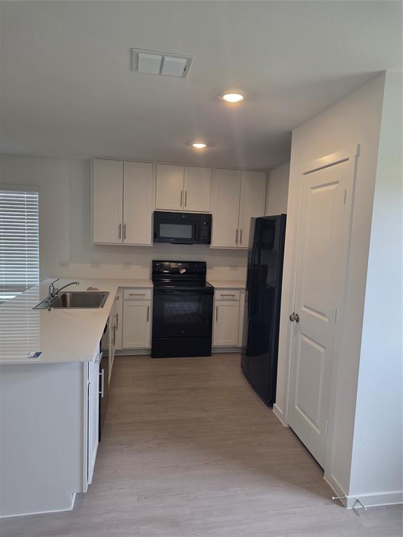 627 Montclair Avenue Princeton, TX 75407 - Photo 7 of 12 a kitchen with stainless steel appliances a refrigerator stove and sink