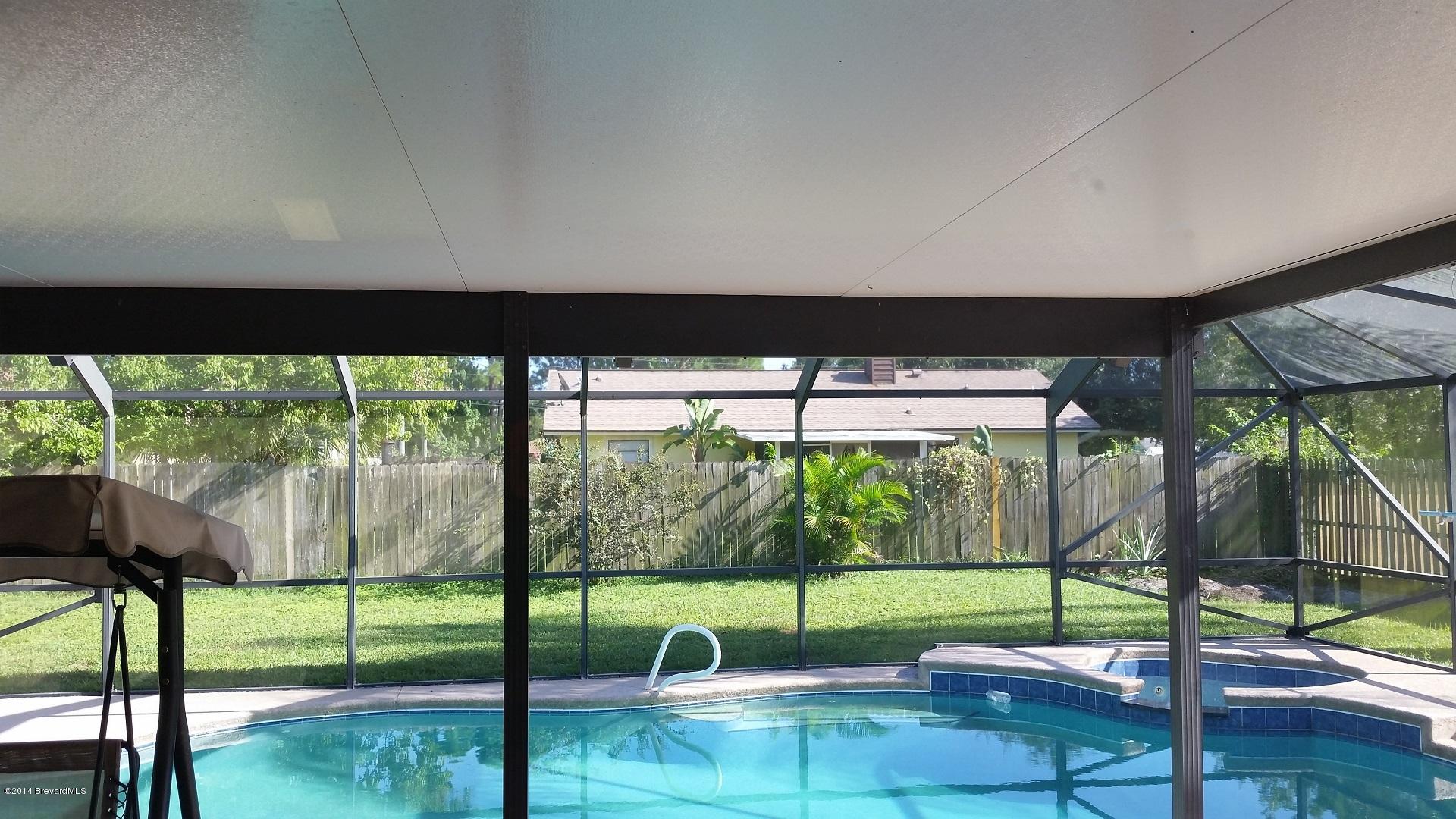 5657 Flint Road Cocoa, FL 32927 - Photo 24 of 29 View of Pool from Inside Home