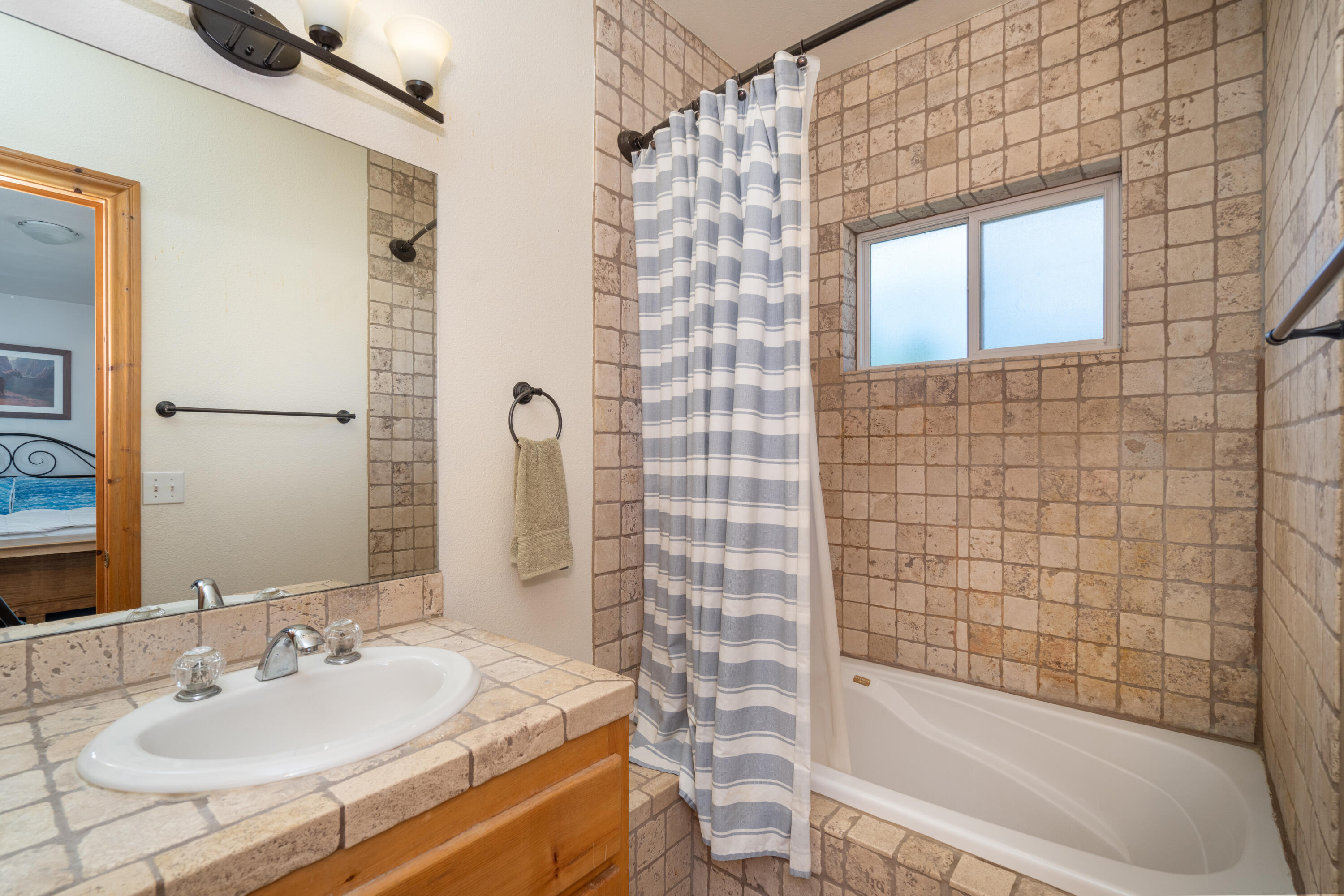 660 Otto Street Ridgway, CO 81432 - Photo 17 of 27 a bathroom with a sink shower and a mirror