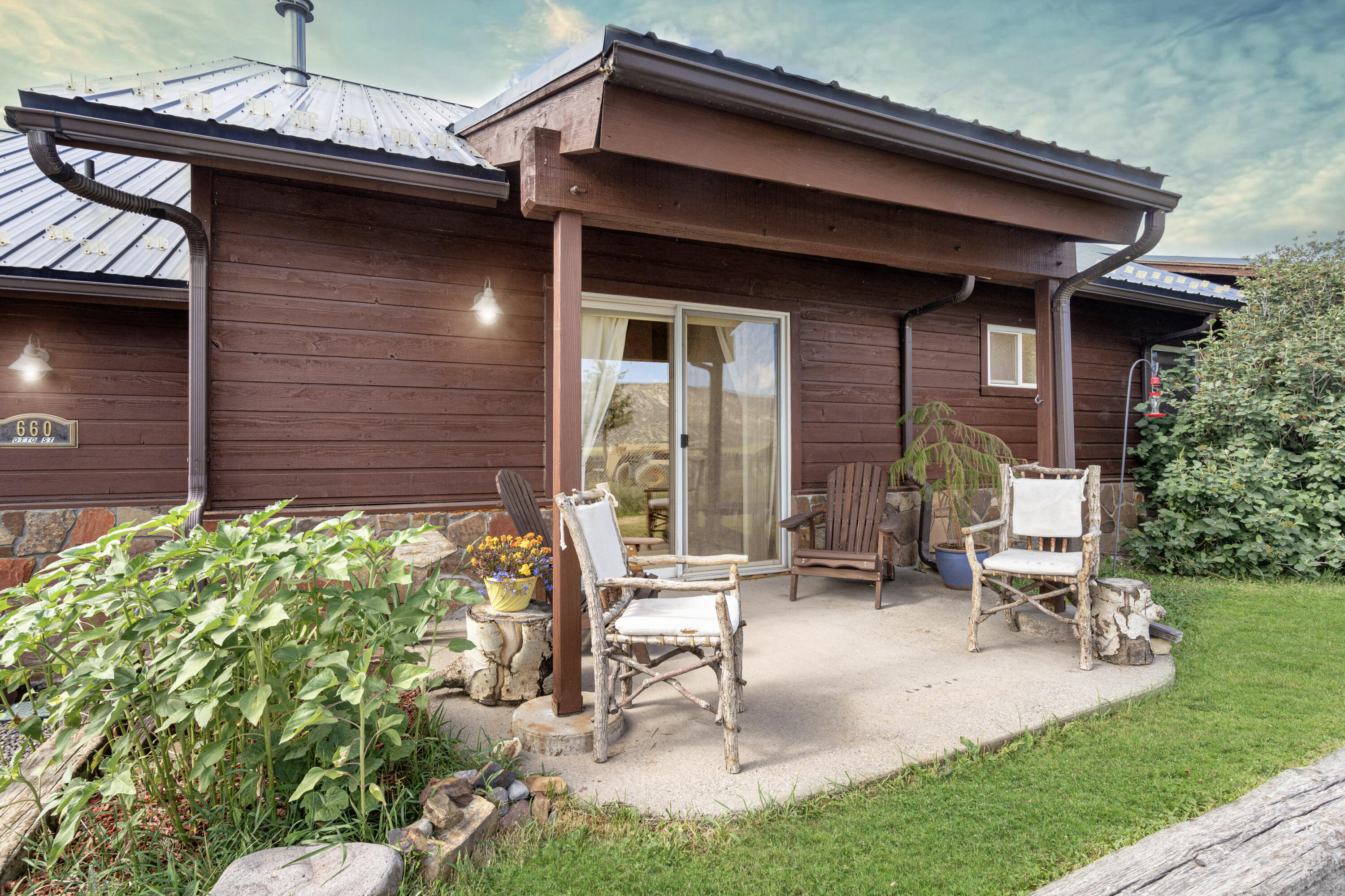 660 Otto Street Ridgway, CO 81432 - Photo 3 of 27 a view of an house with backyard porch and sitting area