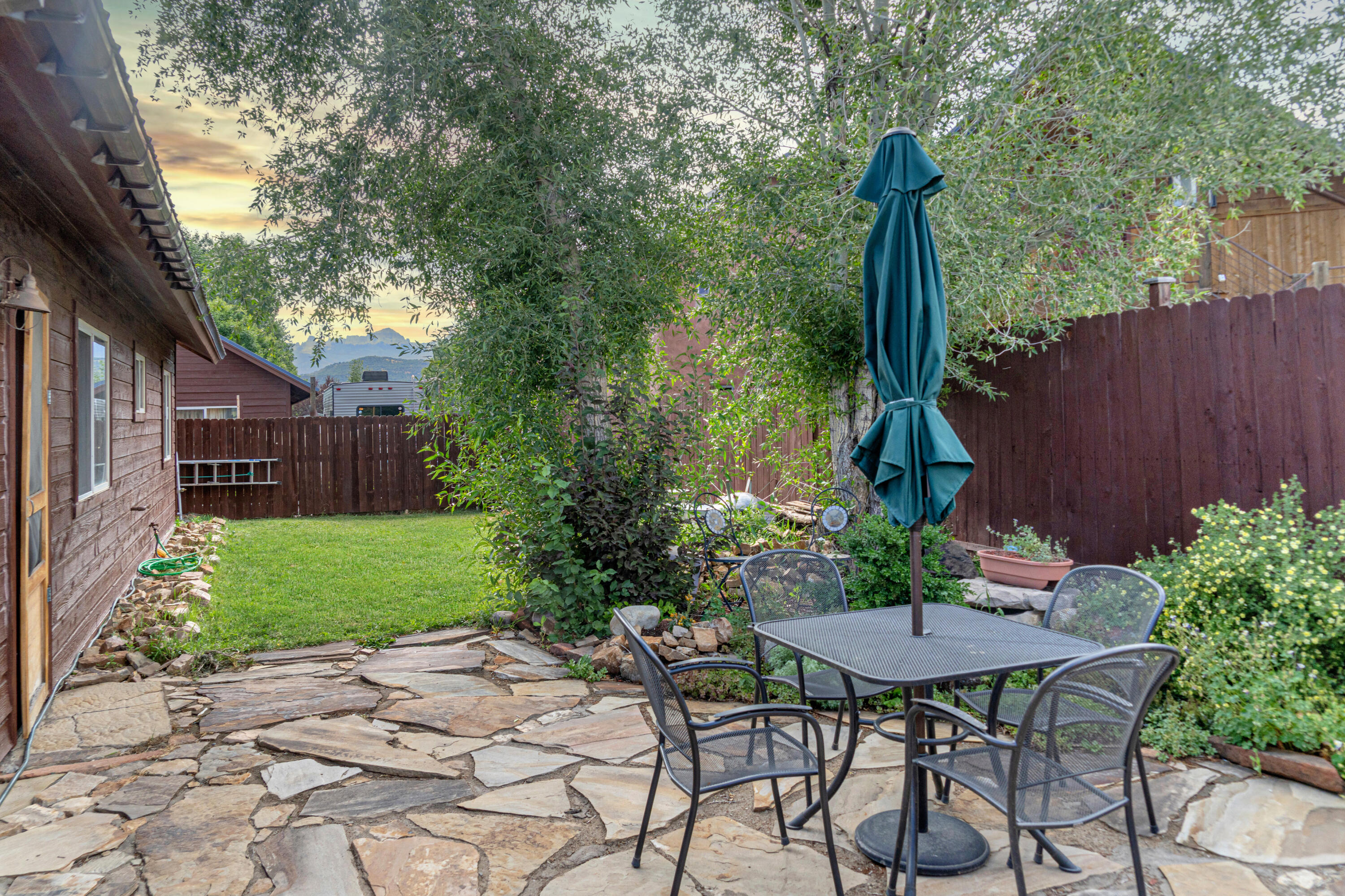 660 Otto Street Ridgway, CO 81432 - Photo 6 of 27 a view of a chairs and table in backyard of the house