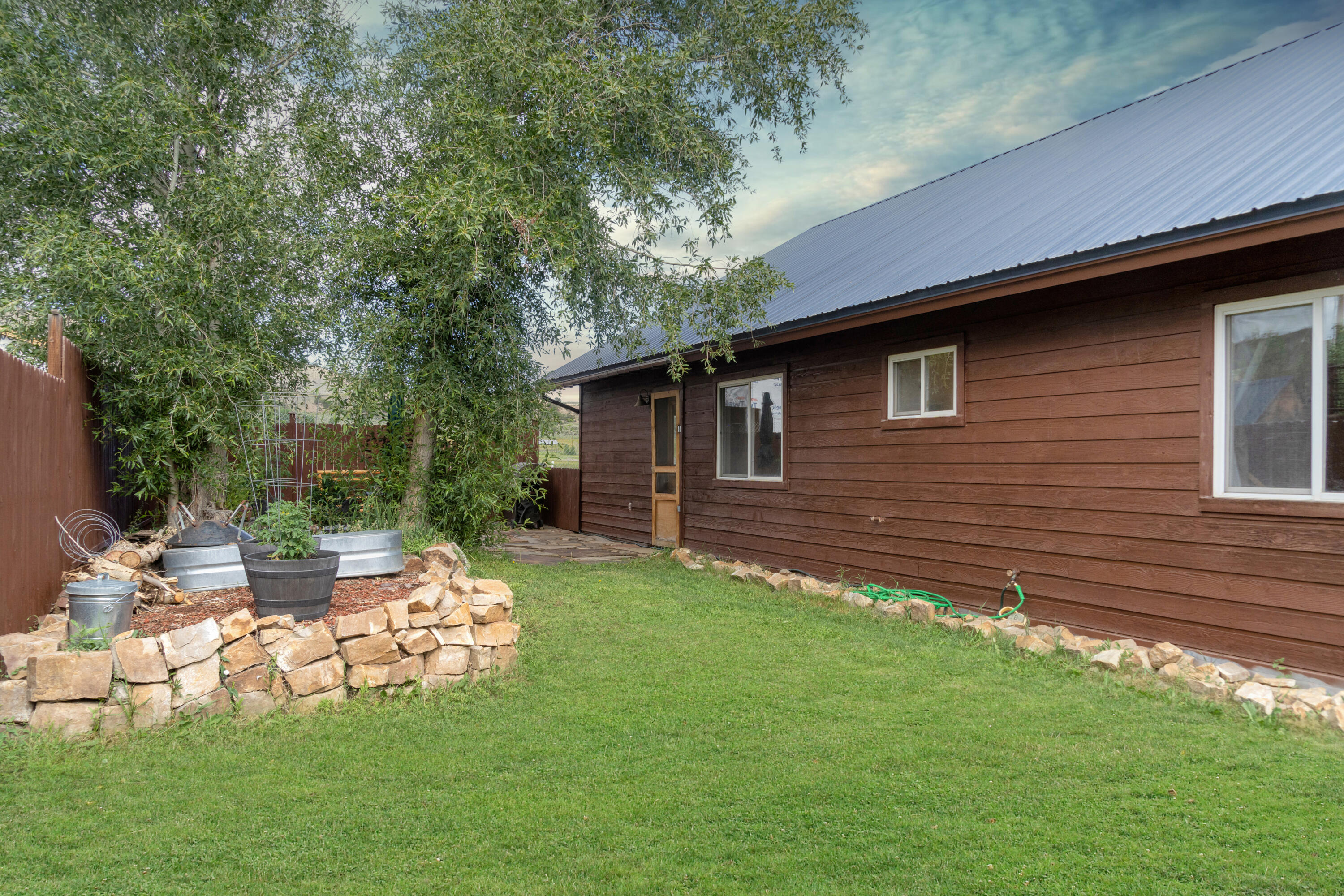 660 Otto Street Ridgway, CO 81432 - Photo 7 of 27 a backyard of a house with table and chairs