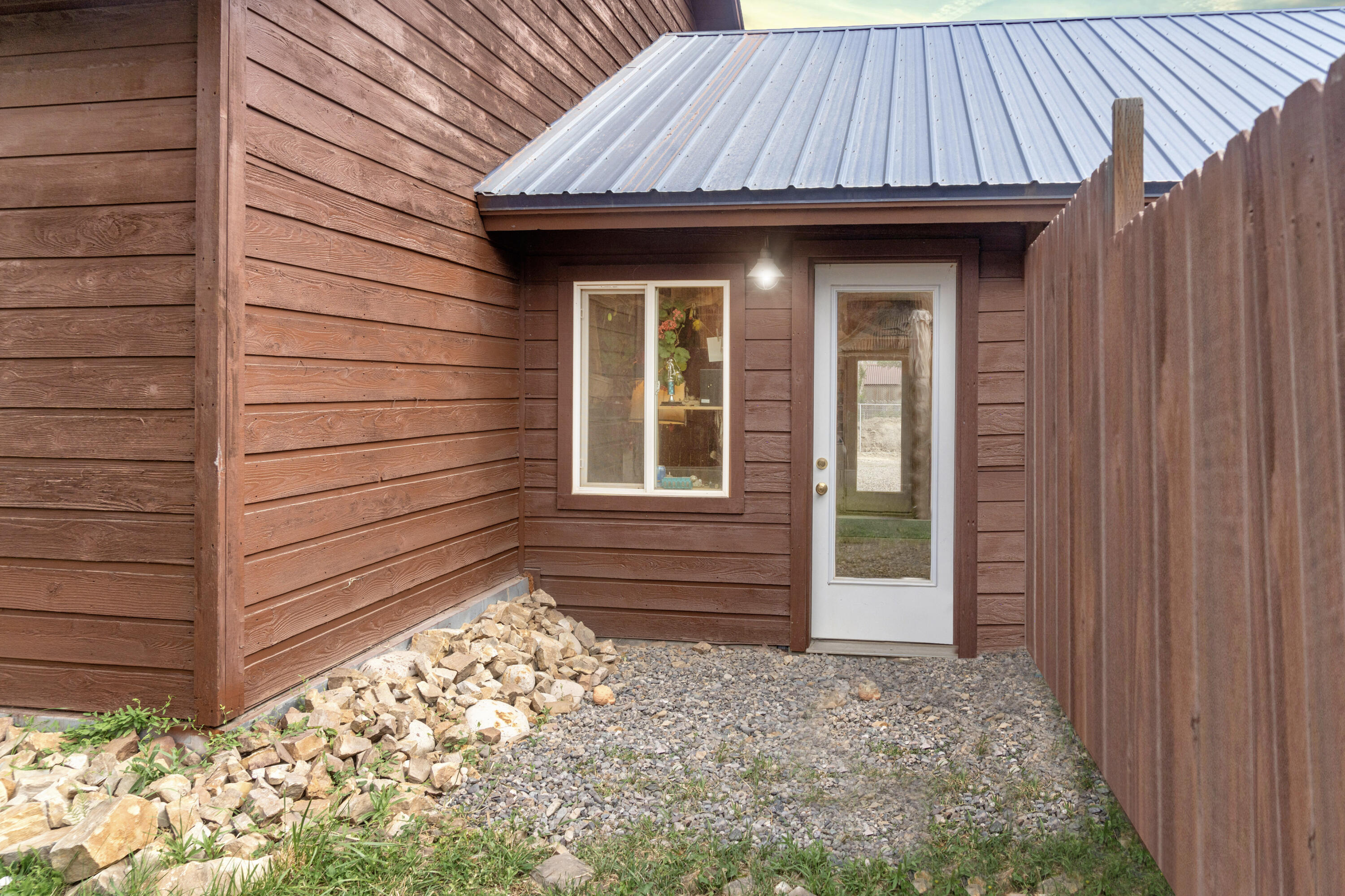 660 Otto Street Ridgway, CO 81432 - Photo 9 of 27 a front view of a house with a garden