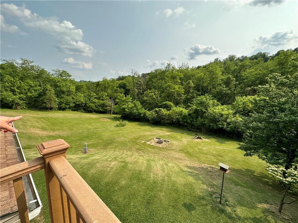 364 Sharpnack Hollow Road Jefferson, PA 15344 - Photo 5 of 31 a view of a lake with a yard