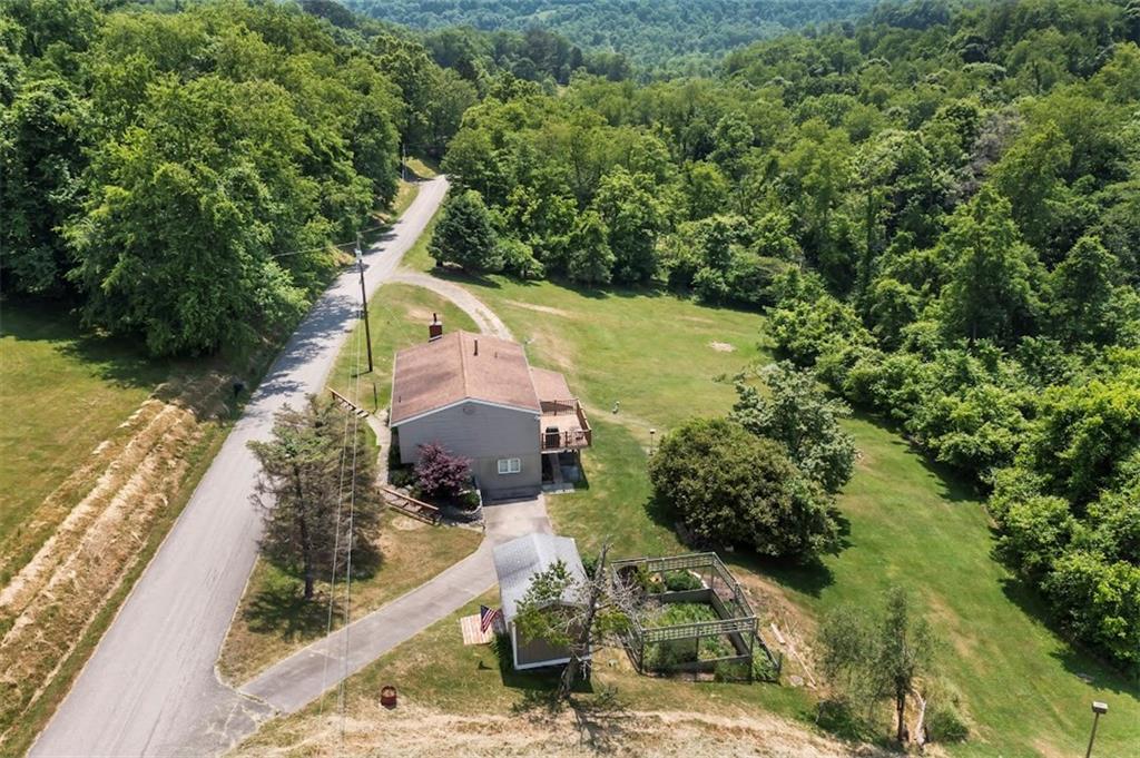 364 Sharpnack Hollow Road Jefferson, PA 15344 - Photo 6 of 31 a aerial view of a house with a yard and large trees