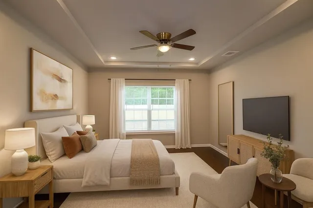 a bedroom with bed and a flat screen tv