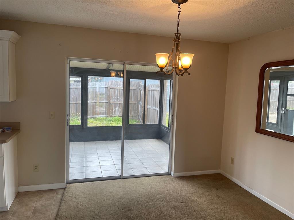 3048 Unity Tree Drive Edgewater, FL 32141 - Photo 3 of 9 a bedroom with bed and a window