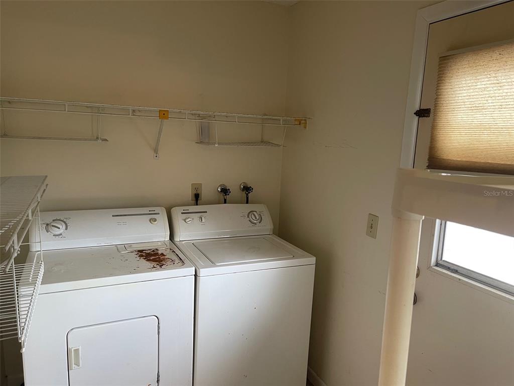 3048 Unity Tree Drive Edgewater, FL 32141 - Photo 5 of 9 a utility room with dryer and washer