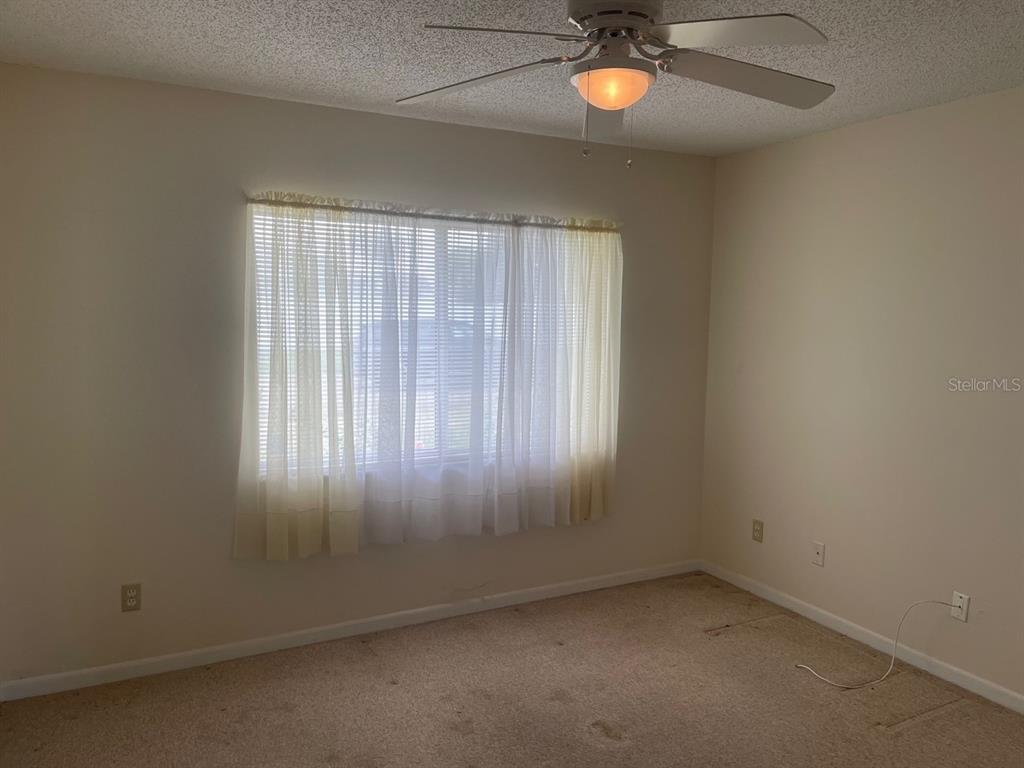 3048 Unity Tree Drive Edgewater, FL 32141 - Photo 8 of 9 an empty room with a window