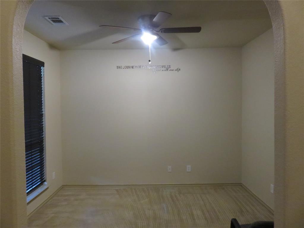 1122 Walter Stephenson Road Midlothian, TX 76065 - Photo 4 of 26 Spacious room featuring neutral-toned walls and wood-finish flooring