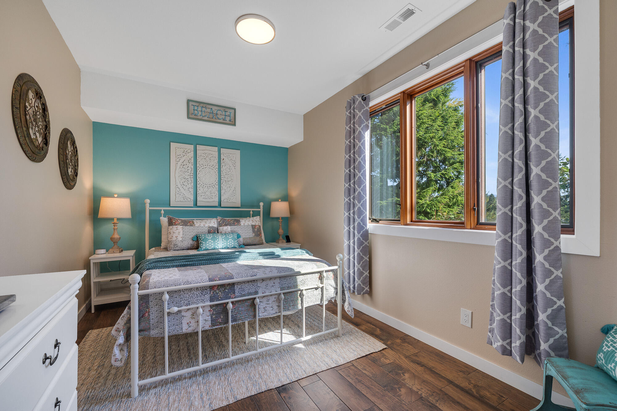 13150 D Street Nehalem, OR 97131 - Photo 22 of 29 a bedroom with a bed next to a large window