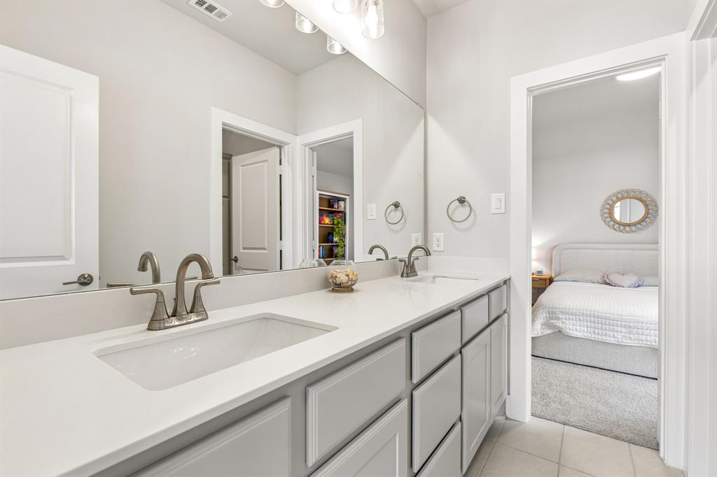 3004 Windy Rdg Road McKinney, TX 75071 - Photo 27 of 40 a bathroom with a sink and a mirror