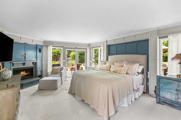 a bedroom with a bed and a couch