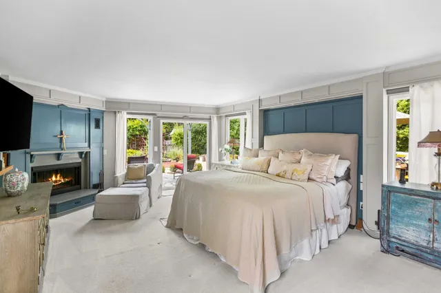 a bedroom with a bed and a couch