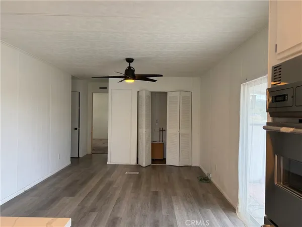 a view of hallway with wooden floor