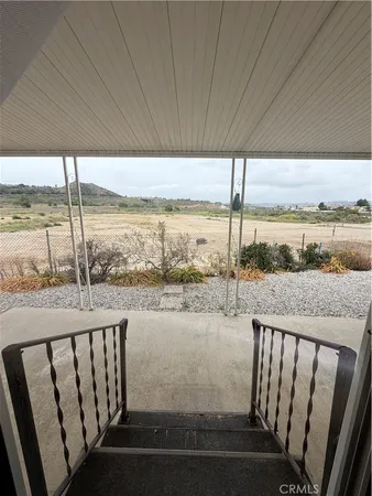 a view of roof deck with ocean view