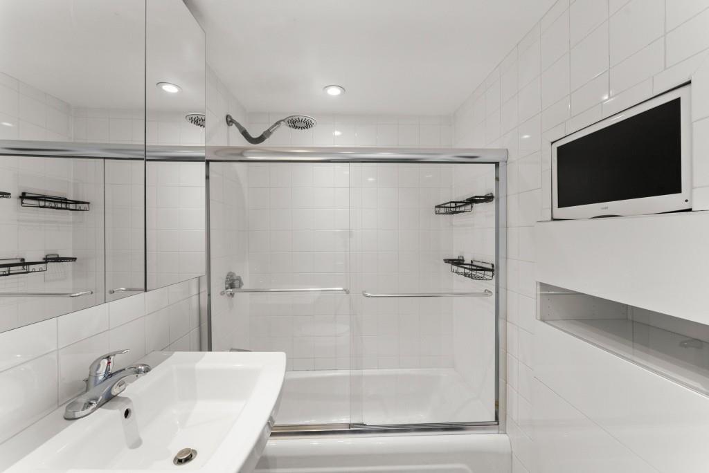 2285 Peachtree Street Northeast, Unit 801 Atlanta, GA 30309 - Photo 16 of 30 a bathroom with a tub and a sink