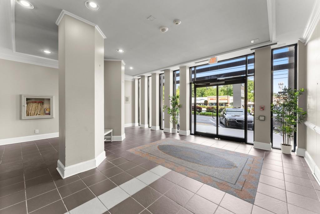 2285 Peachtree Street Northeast, Unit 801 Atlanta, GA 30309 - Photo 17 of 30 a view of a room with furniture and large windows