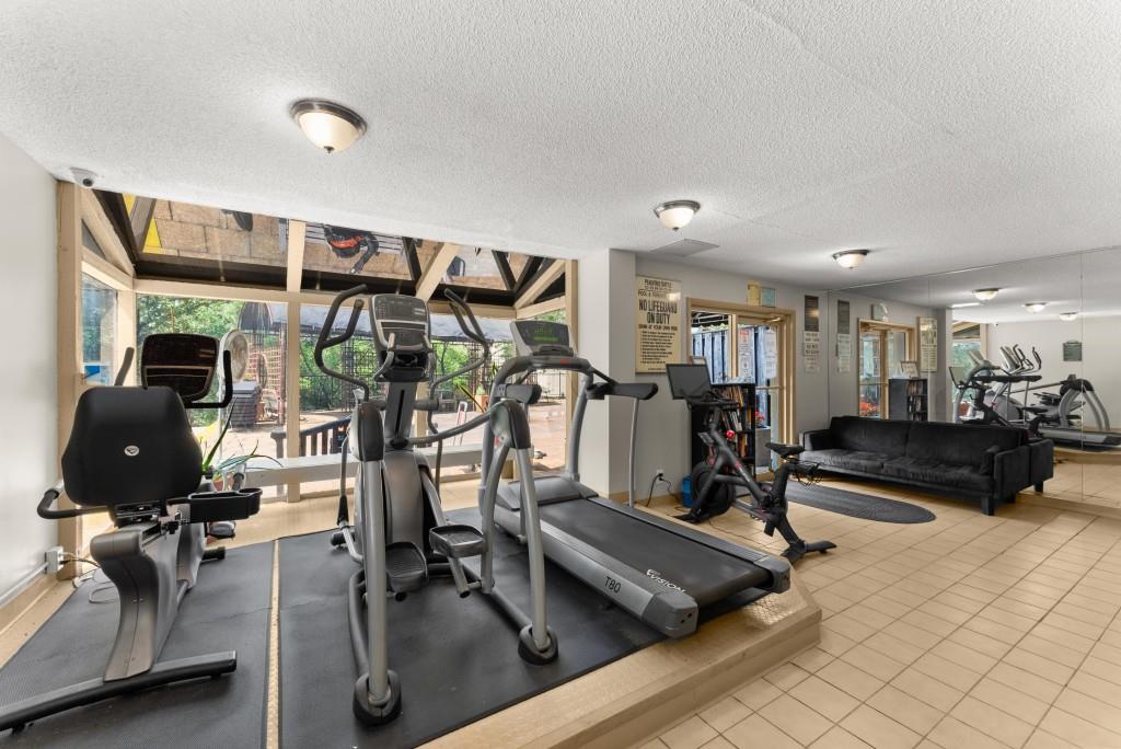 2285 Peachtree Street Northeast, Unit 801 Atlanta, GA 30309 - Photo 18 of 30 a view of a room with gym equipment