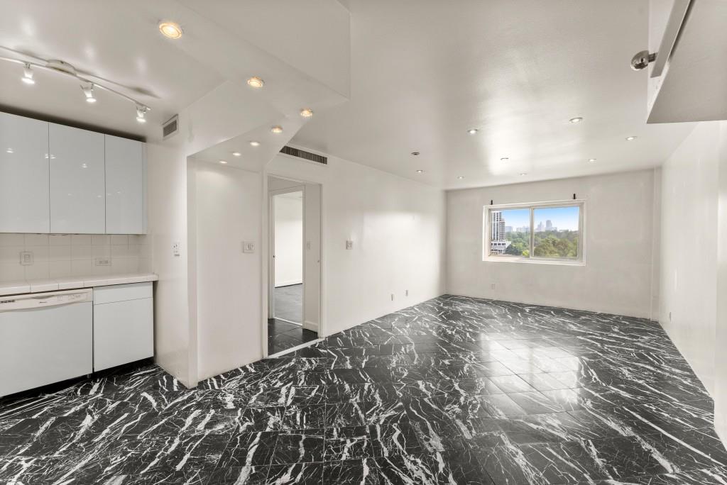 2285 Peachtree Street Northeast, Unit 801 Atlanta, GA 30309 - Photo 2 of 30 a view of a hallway with closet and window