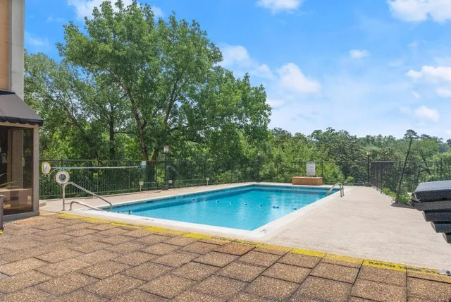 a view of a swimming pool with a lounge chair