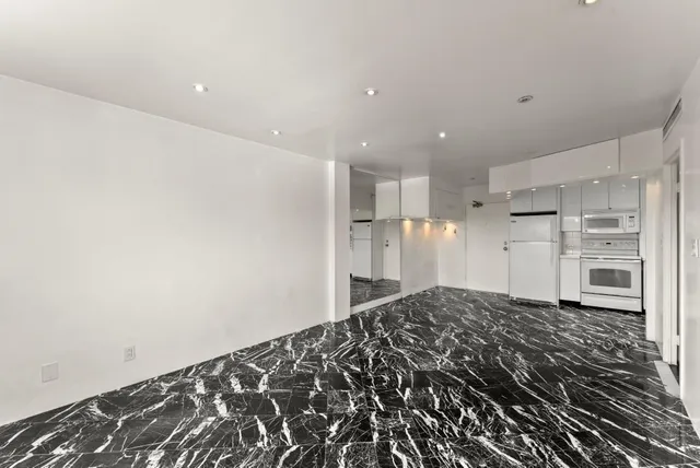 a view of a kitchen with a sink