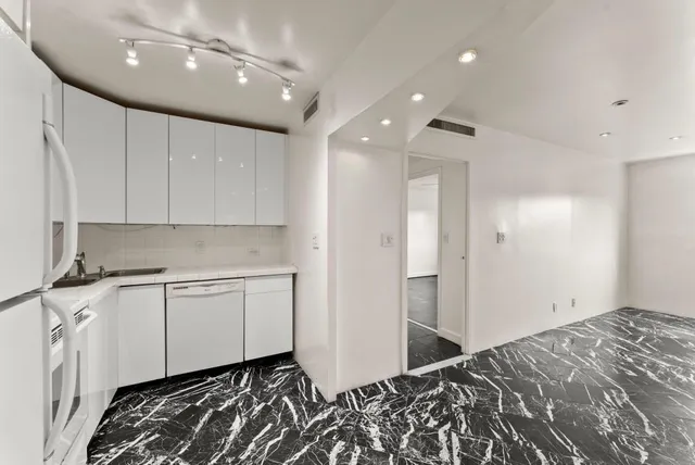 a room with a bed and a window