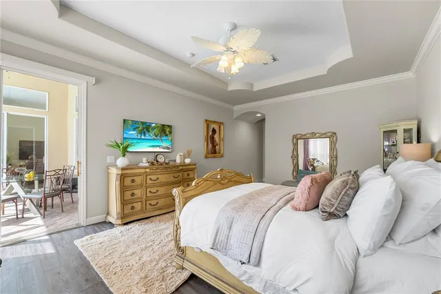 a bathroom with a granite countertop tub double vanity sink and a large mirror