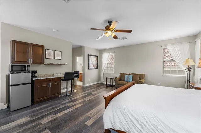 a bathroom with a sink mirror toilet and bathtub