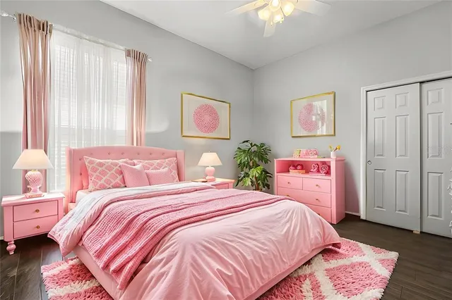 a view of walk in closet with clothes