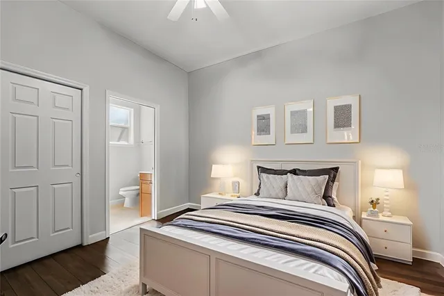 an aerial view of residential houses with outdoor space and lake view