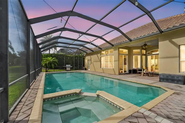 a view of a backyard with sitting area