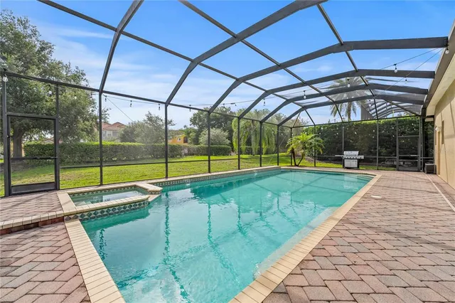 a view of a backyard with a swimming pool