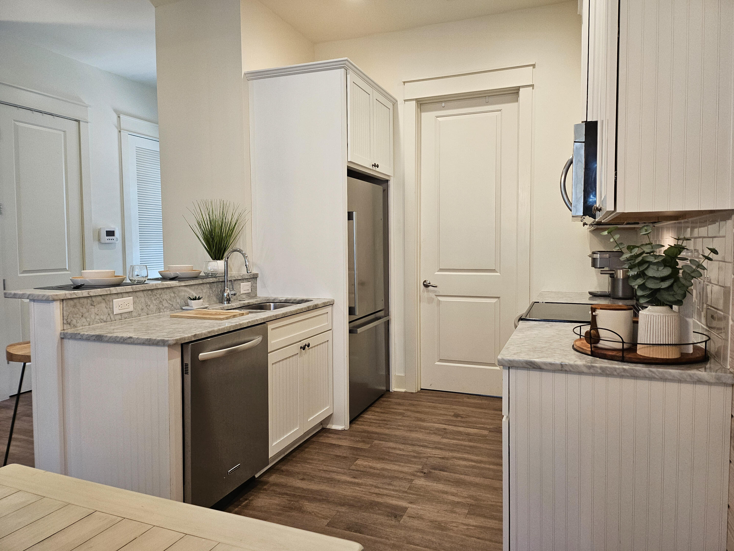 10 Gulfview Way Santa Rosa Beach, FL 32459 - Photo 20 of 40 a kitchen with stainless steel appliances granite countertop a sink and a refrigerator